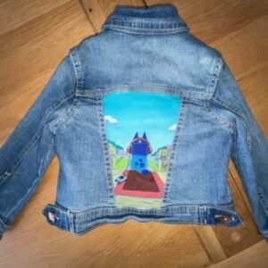 Back of child's denim jacket with back panel showing Bluey sat on her porch wearing headphones